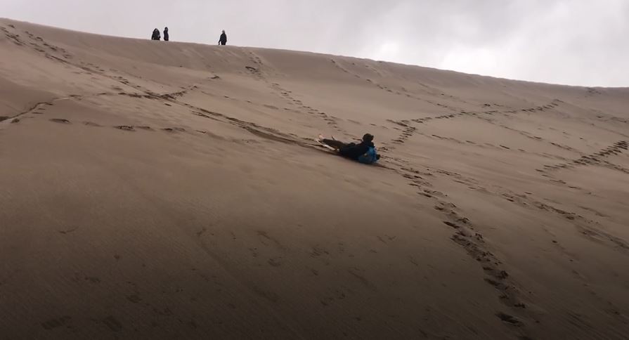 Bryan boarding the dunes